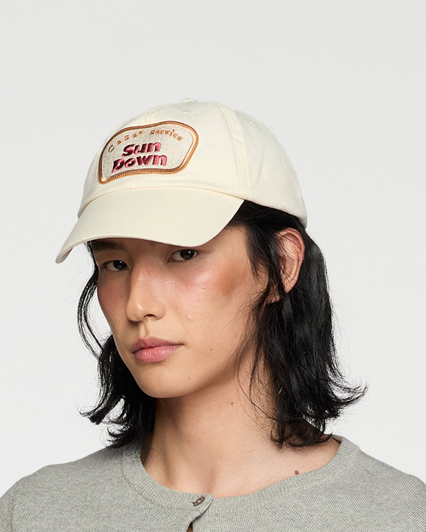 CREAM SUN DOWN CAP